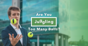 A concerned man dressed in business attire juggling yellow tennis balls